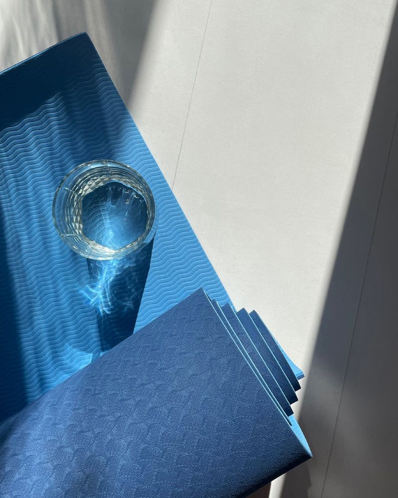 Spacious and bright room with a yoga mat on the floor.